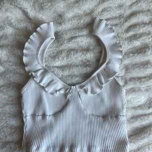 White ruffled top